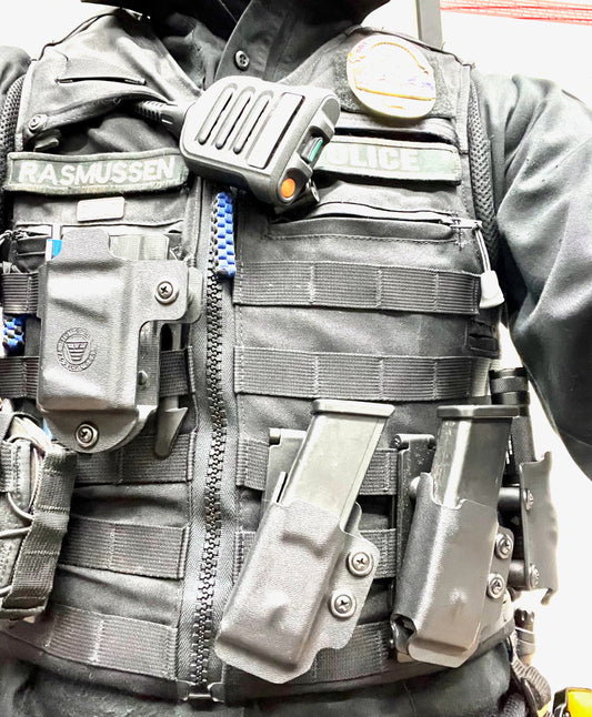My patrol vest.  Angled mag pouches, BWC mount and field testing a flashlight mount. 